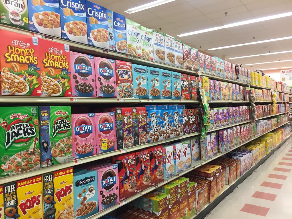 A store shelf filled with chocos and cornflakes