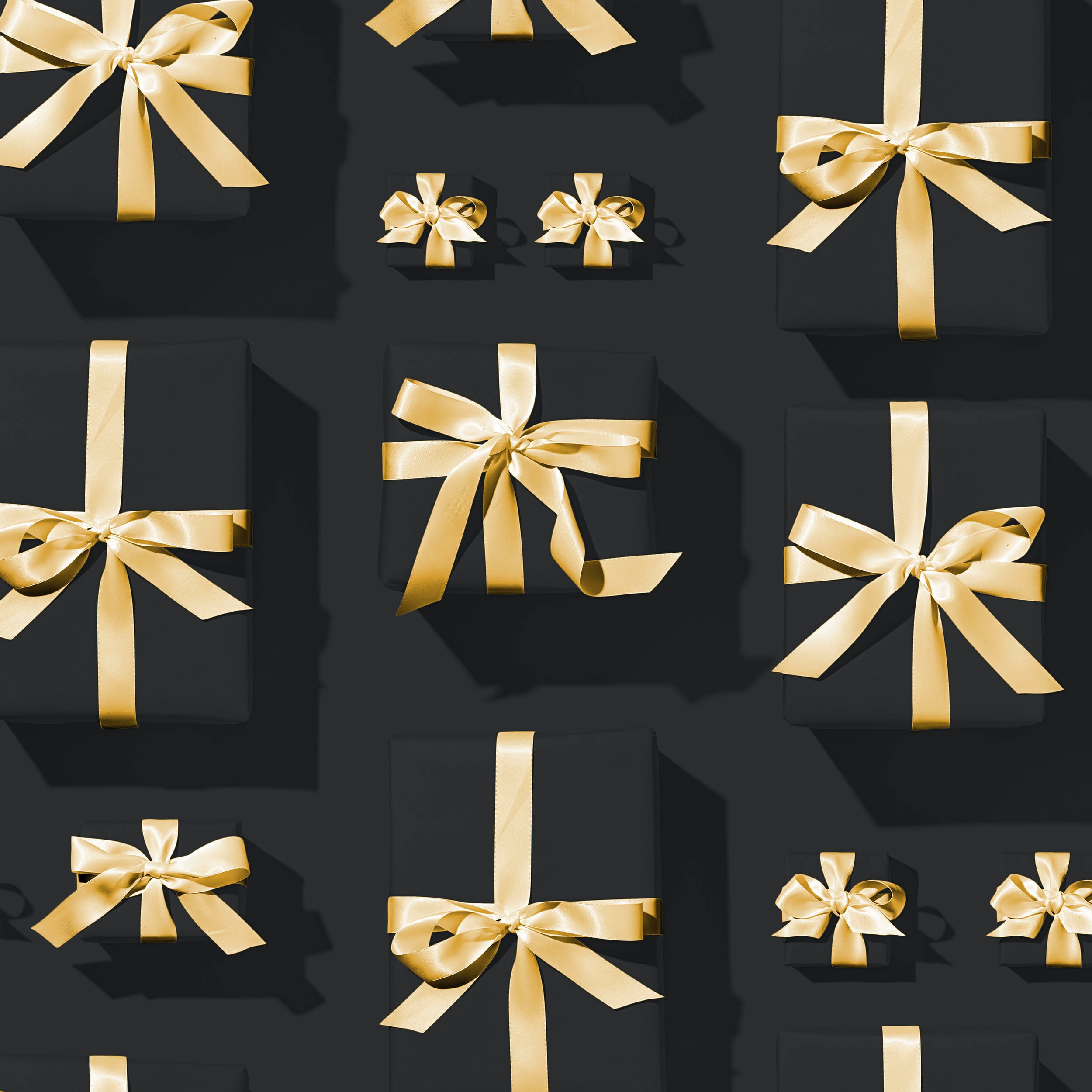 Many gift boxes are wrapped up in black.