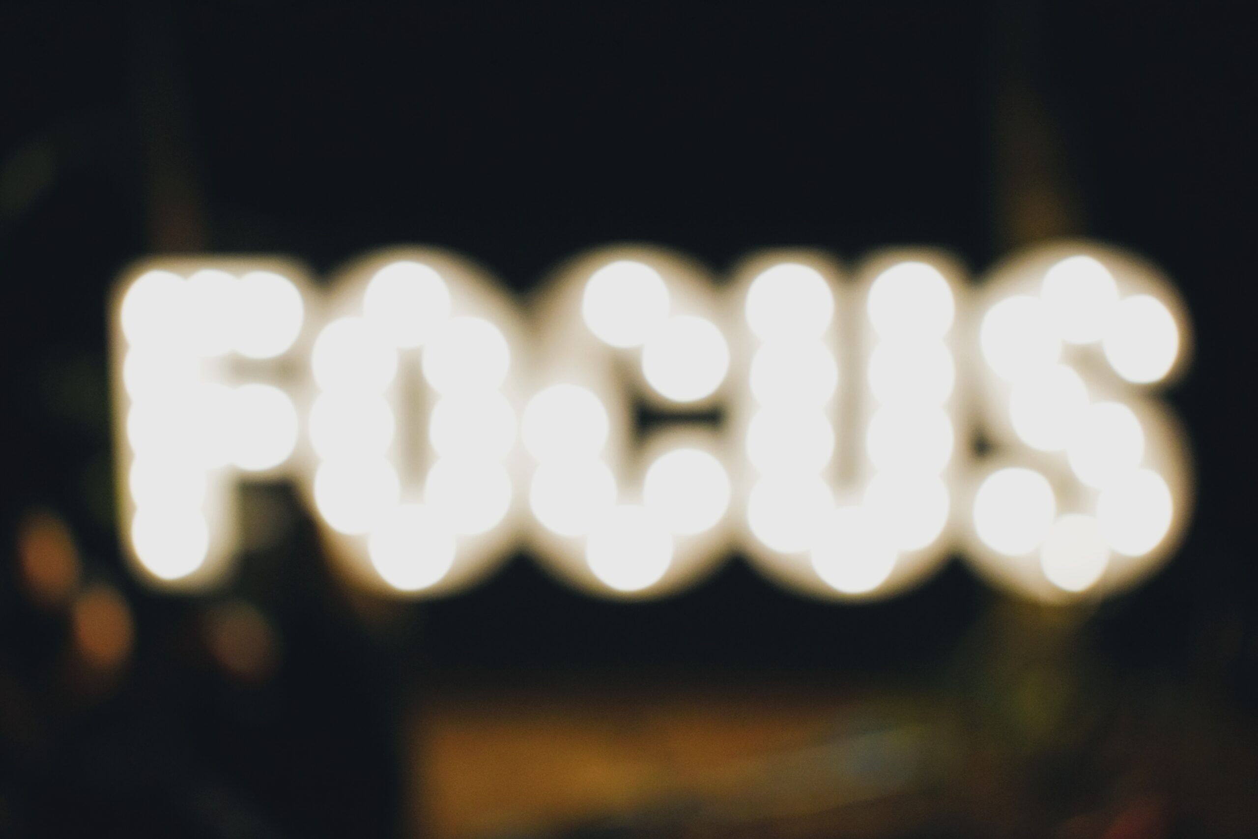 A photograph of a blurred picture of the word FOCUS